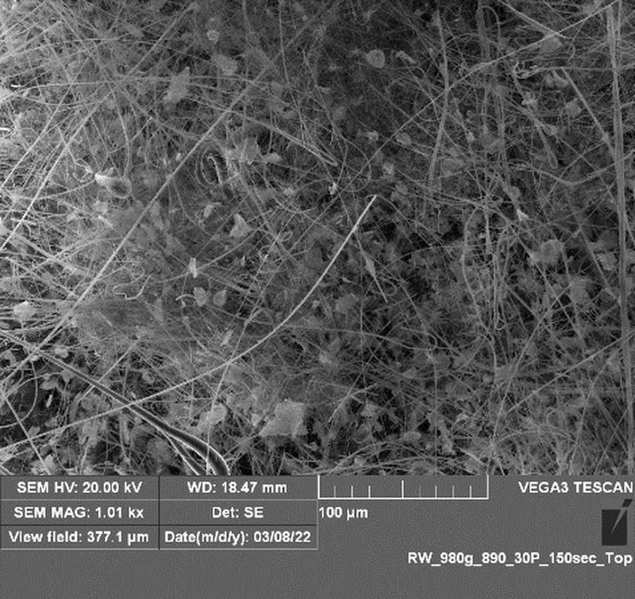 Scanning electron micrograph of a borosilicate glass microfiber mat with graphene sheets draped across the fibers. The instrument data bar reads SEM HV 20.00 kV, magnification 1.01 kx, view field 377.1 microns, detector SE, VEGA3 TESCAN.